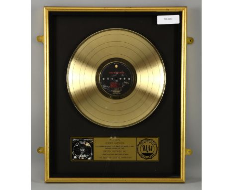 George Harrison - Gold Disc with plaque saying Presented to George Harrison to commemorate the sale of more than 500,000 copi