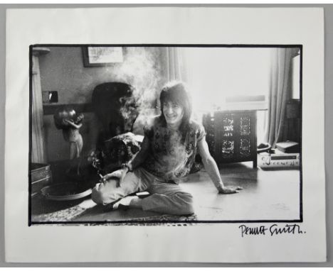 Ron Wood Rolling Stones photograph autographed by photographer Pennie Smith circa 1980’s with Smith’s Osterley stamp to rever