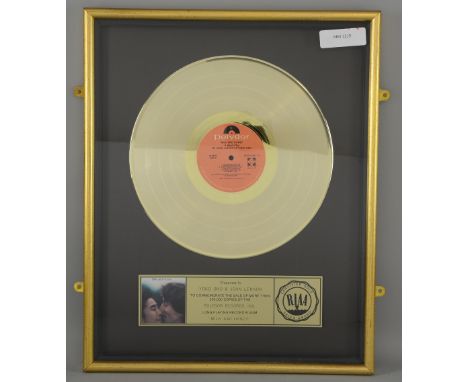 John Lennon & Yoko Ono - Gold Disc with plaque saying Presented to YOKO ONO & JOHN LENNON to commemorate the sale of more tha