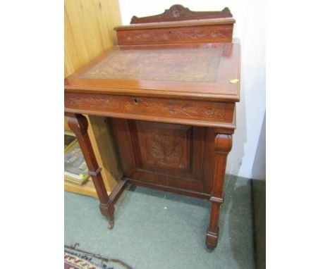 EDWARDIAN WALNUT DAVENPORT, carved cresting and 4 side drawers