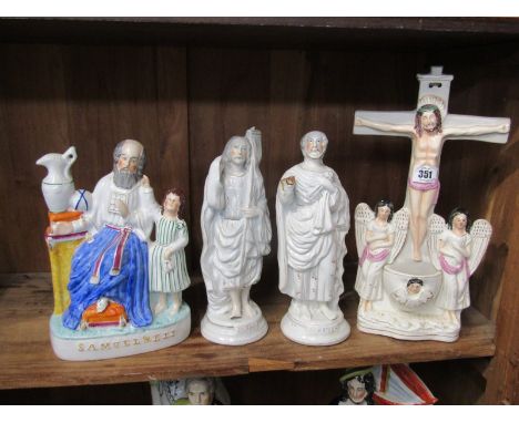 STAFFORDSHIRE POTTERY, a group of 4 religious based figures including Crucifix Holy Water holder, St. John &amp; St. Peter (h