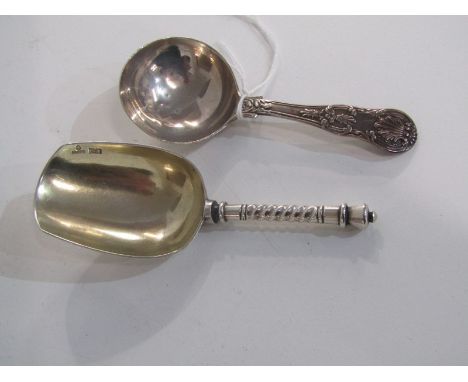 RUSSIAN SILVER CADDY SPOON with silver gilt bowl, Russian HM, 10.5cm,; together with another silver caddy spoon with foliate 