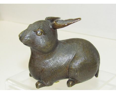 ORIENTAL METALWARE, Japanese bronze rabbit, a finely modelled rabbit, inscribed mark to base, Meiji period. 9cm wide