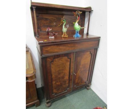 EARLY VICTORIAN MAHOGANY NARROW CHIFFONIER, flame mahogany twin panelled cupboard base, single frieze drawers with tapering c