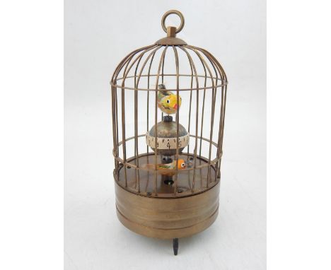 A Victorian style gilt metal bird automaton timepiece. 