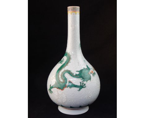 A contemporary Chinese stem vase, enamelled and polychrome decoration, white flowers all over the 'onion' body, green open mo