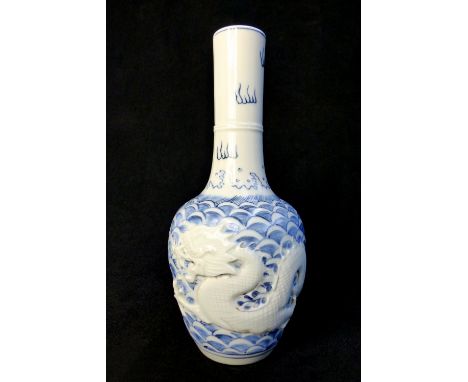 Chinese stem bottle vase, blue and white glaze, open mouth five claw dragon in relief chasing a white flaming pearl, tablet s