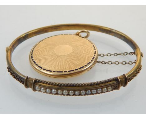 15ct gold bangle with pearl decoration, and a circular locket with enamel band