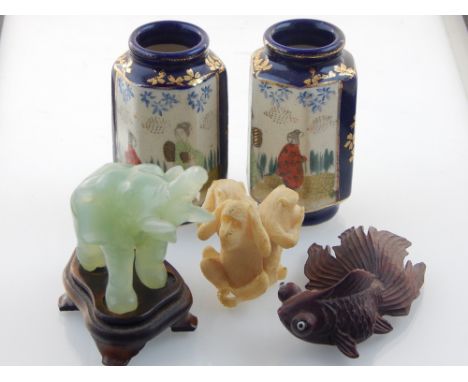 A Koi carp carving, a pair of Japanese miniature hexagonal vases, a jade elephant and a three wise monkey group. (5)
