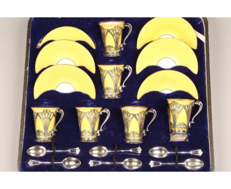 Cased Bone China coffee set, 6 coffee cans with silver holders London 1908, 6 saucers, 6 silver coffee spoons London 1907, to