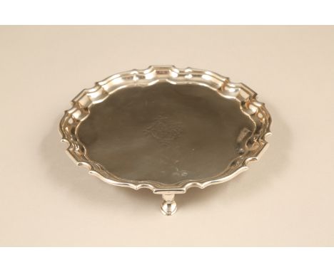 George II silver card tray, pie crust edge raised on three stepped pad feet, assay marked London 1750 by Robert Abercromby en