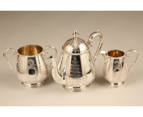 Victorian three piece silver tea service with chased floral decoration and gilded interior. Assay marked London 1875 by Thoma