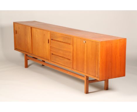 Nils Johnsson for Troeds large 1960s teak sideboard made in Sweden which consists of two sliding doors, four drawers and a pu