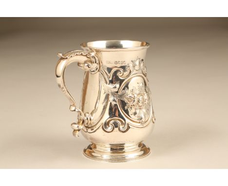 Victorian silver embossed tankard, scroll handle, embossed scroll and floral decoration. Assay marked London 1863 by Augustus