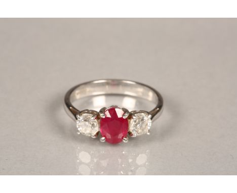 Ladies 18 carat white gold ruby and diamond ring, central ruby flanked by a brilliant cut diamond on either side, each diamon