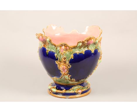 Victorian majolica jardinere and stand, decorated in blue green and pink enamels. 123cm high The jardiniere comes with a colu