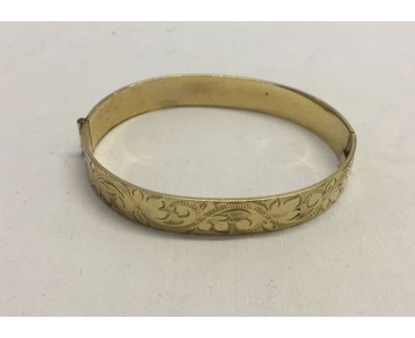 A 9ct rolled gold bangle