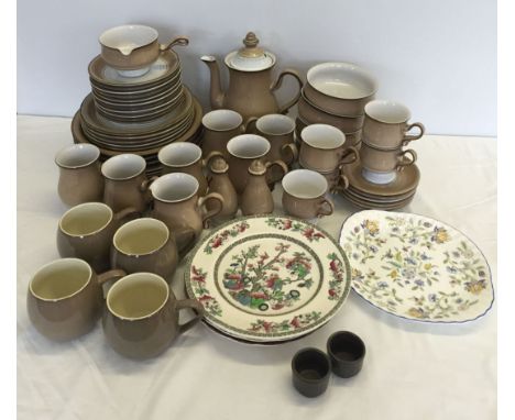 A collection of Denby dinnerware in cream and beige comprising 6 mugs, milk jug, coffe pot, salt and pepper, 7 dinner plates 