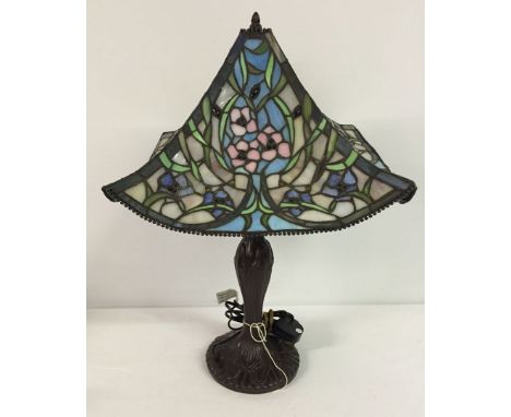 A modern Tiffany style lamp with leaded glass shade.