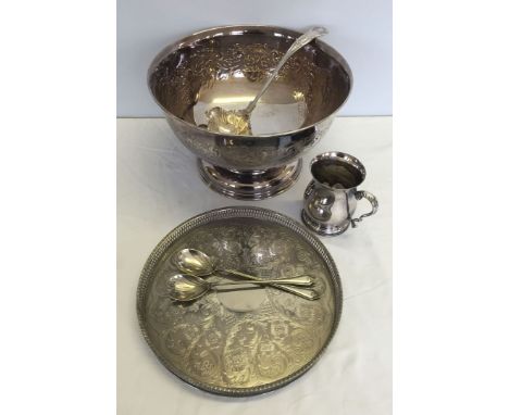 A silver plated punch bowl, ladle, tray, tankard and salad servers