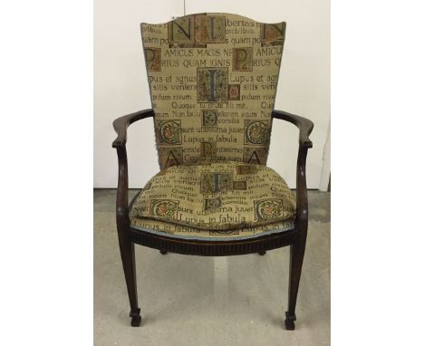 A tapestry design upholstered library chair with cushion