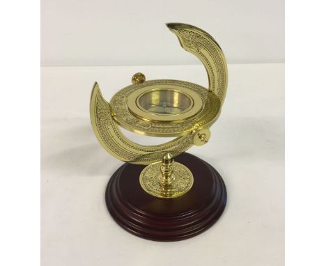 A reproduction brass compass. A commemorative piece from 'The Discovery of America' series 1492-1992.