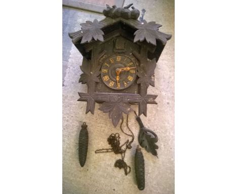 A vintage Black Forest wall mounted cuckoo clock.