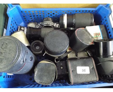 A Box Containing Nine Camera Lenses, Filters, Light Meters, Cigarette Lighter in the Form of a Camera etc
