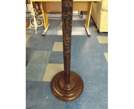 A Carved Chinoiserie Standard Lamp