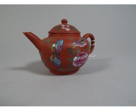 A Small Hand Painted Terracotta Oriental Teapot
