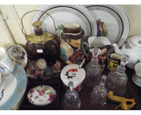 A Tray Containing Ceramic, Plates, Glass Bells, Musical Decanter etc