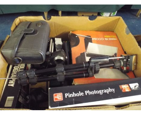 A Box Containing Various Photographic Accessories light etc