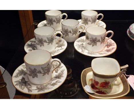 Six Wedgwood 'Ashford' coffee cans and five saucers together with a Flavelle Brothers Ltd for Royal Worcester with hand-paint