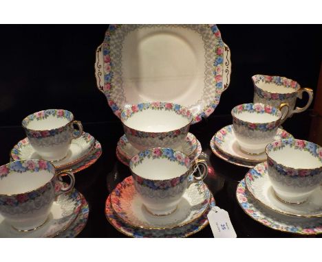 A Crown Staffordshire tea set having floral pattern comprising of cups (5), saucers, sandwich plate, milk jug, sugar bowl