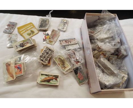 A large quantity of assorted cigarette cards to include 'Army Corps & Divisional Signs 1914-1918', 'The Reason Why', Carreras