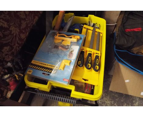 A Stanley tool box with assorted new and used tools