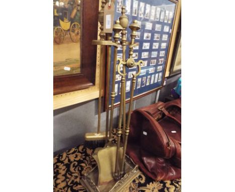 A brass fire stand with tools