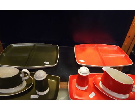 Two 1970's Carlton condiments in red ad green comprising of salts and peppers, sauce boats and sectional dished 