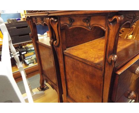 A pair of Art Nouveau bedside tables having glass top insets with two drawers under
