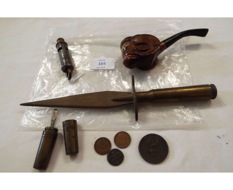A carved pipe, whistle, trench art dagger, needle case and some coins