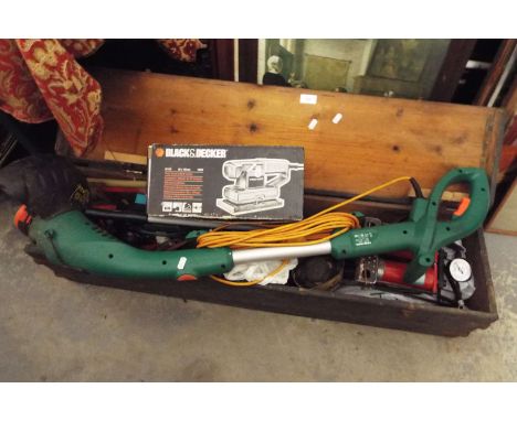 A pine chest containing assorted tools to include electric sander strimmer, hand tools etc
