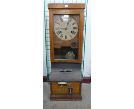 An early 20th Century oak National Time Recorder Co. Ltd. clock 