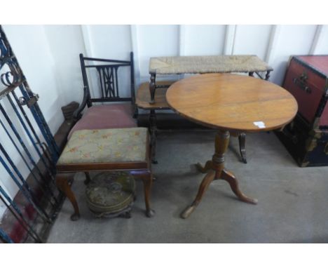 A Victorian upholstered chair, a tripod table, walnut coffee table and three stools 