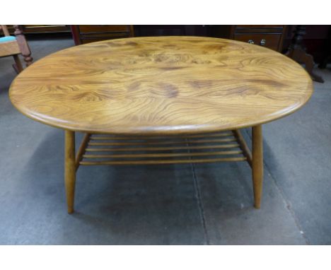 An Ercol Blonde elm oval coffee table 