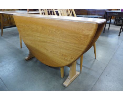 An Ercol Blonde ash drop leaf table 