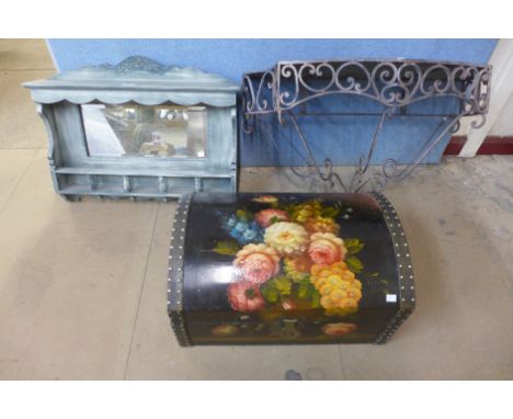 A hand painted trunk, a cast metal bracket and one other 