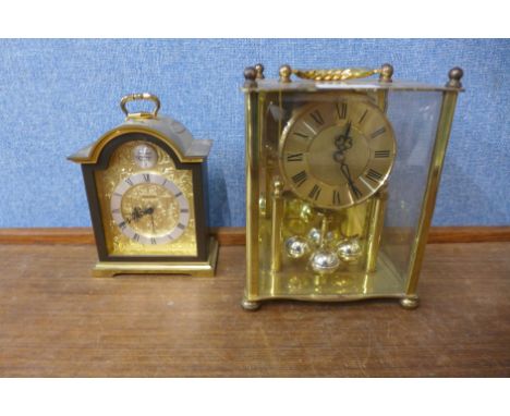 A Swiza clock, anniversary clock and a ceramic Staffordshire flat back clock 
