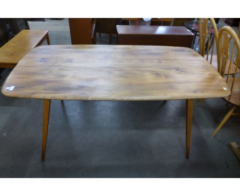 An Ercol elm and beech plank refectory table 