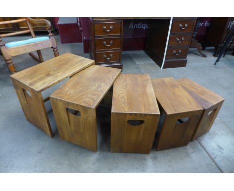 An Ercol Blonde elm nest of five tables 