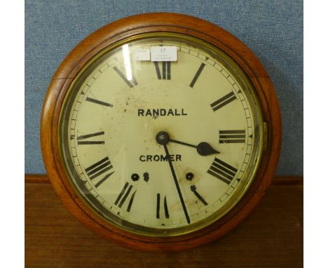 An oak circular wall clock, the dial signed Randall, Cromer 